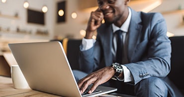 man laptop smiling 370x195 1 1